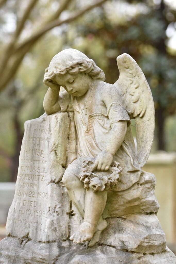 pexels photo 14845468 A beautiful stone angel sculpture in a peaceful cemetery setting.